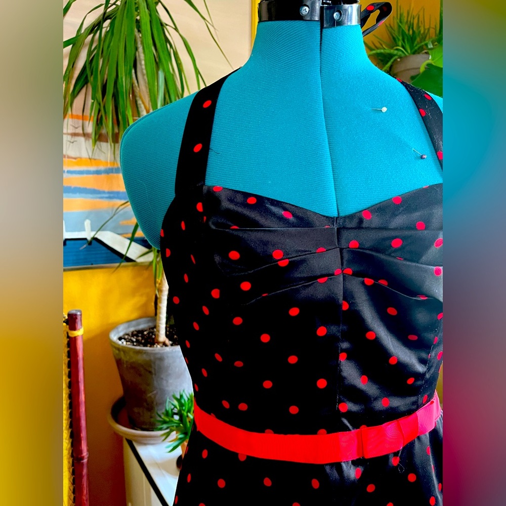 Black flared skirt party dress with red polka dots